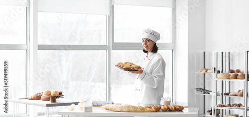 Female baker with fresh cak...