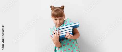 Cute little schoolgirl with...