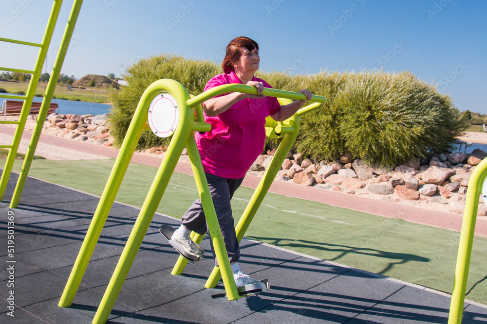 Fototapeta premium Grandma regularly plays outdoor sports and is doing well in her seventies, an active lifestyle, healthy diet and regular exercise keep her in good shape.