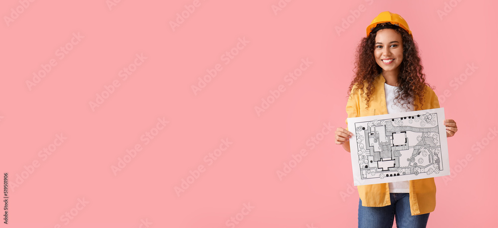 African-American female landscape designer with new project on pink background with space for text African-American female landscape designer with new project on pink background with space for text