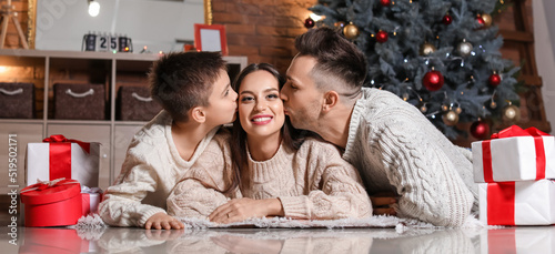 Happy family at home on Chr...