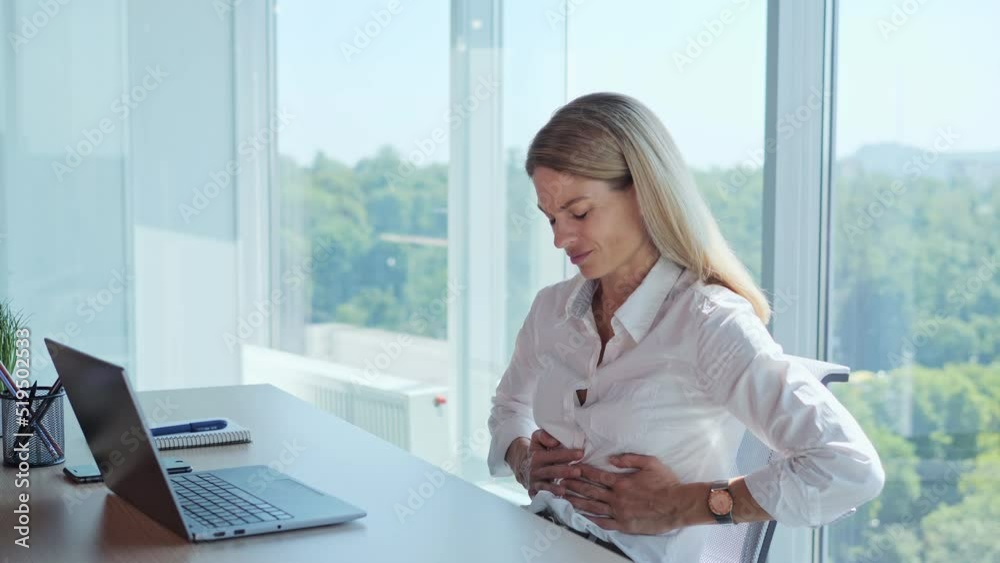 Stomach pain. Female hands touching stomach. Diarrhea, constipation, irritable bowel. Office employee suffering stomach pain and nausea, poisoning unhealthy nutrition. Adult businesswoman feeling bad.