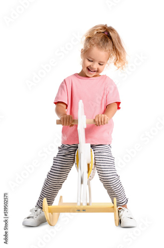 Cute little girl with rocki...