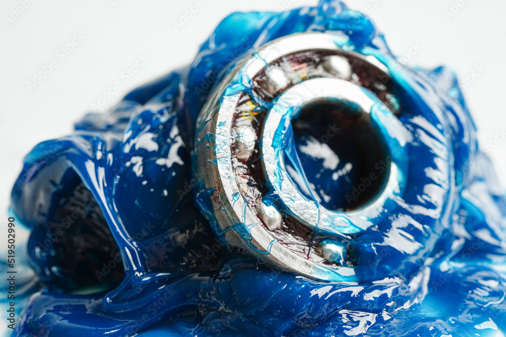 Grease and ball bearing, Blue premium quality synthetic lithium complex grease, high temperatures and machinery lubrication for automotive and industrial. Grease and ball bearing, Blue premium quality synthetic lithium complex grease, high temperatures and machinery lubrication for automotive and industrial.
