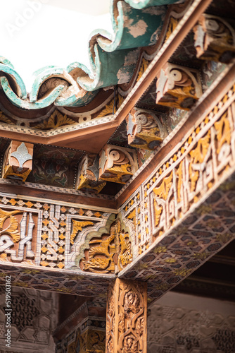 Old traditional arabian style decoration wooden column corner on an ancient landmark in Marrakesh