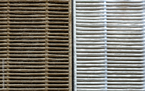 Close-up Old and new air purifier filter in comparison: dusty, dirty filter after use and clean.