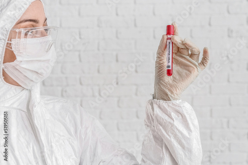 Scientist with sample of mo...