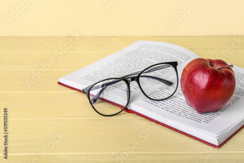 School book with apple and ...