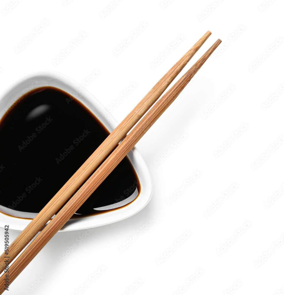 Bowl of soy sauce and chopsticks on white background Bowl of soy sauce and chopsticks on white background