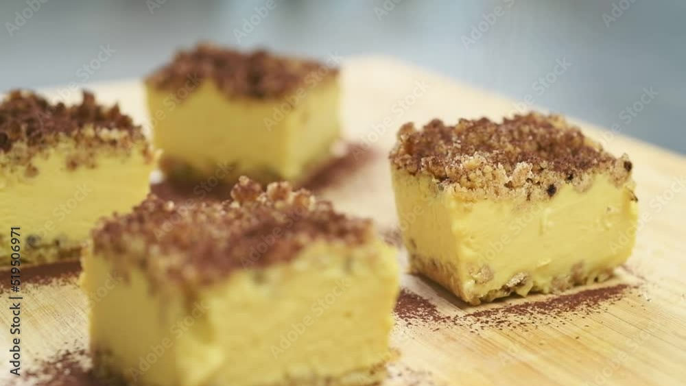 Sprinkling cocoa powder on tiramisu ice cream sandwich.
Sprinkling cocoa powder on tiramisu ice cream sandwich.