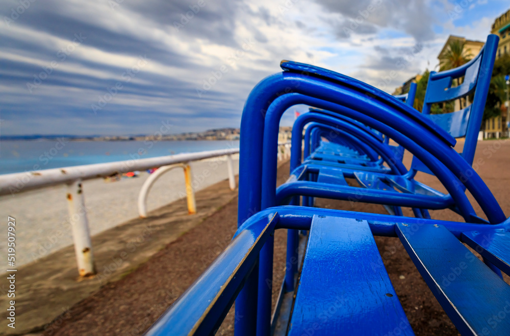 Blue chairs on the Promenade des Anglais in Nice France Blue chairs on the Promenade des Anglais in Nice France