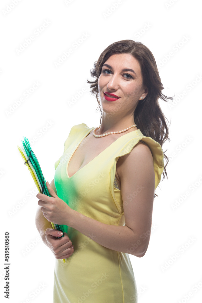 One Positive and Smiling Mature Caucasian Business Woman in Yellow Dress With Colorful Folders Against White Background One Positive and Smiling Mature Caucasian Business Woman in Yellow Dress With Colorful Folders Against White Background