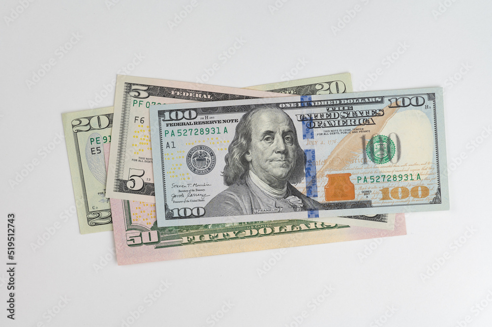 5, 20, 50, 100 dollars banknotes at different angles. Close up of dollars on white background. 5, 20, 50, 100 dollars banknotes at different angles. Close up of dollars on white background.