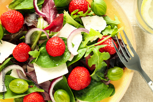 Concept of tasty salad  salad with strawberry  close up