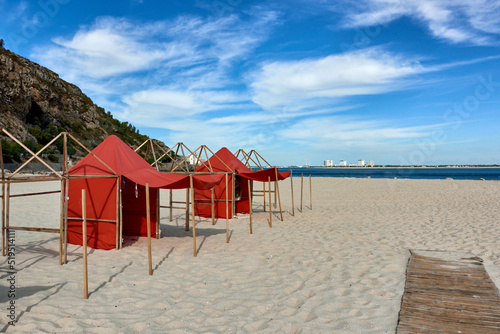 beach tents on Figueirinha beach, in the district of Setubal, portugal photo