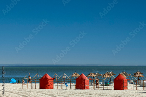 beach tents on Figueirinha beach, in the district of Setubal, portugal photo
