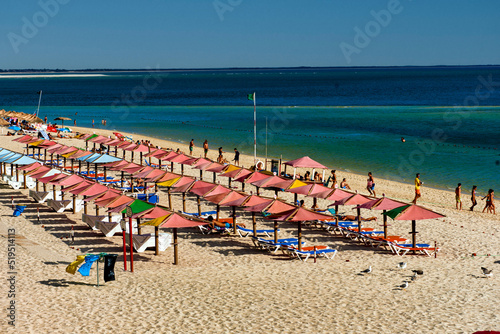 parasol and beach chairs on Figueirinha beach, in the district of Setubal, Portugal photo