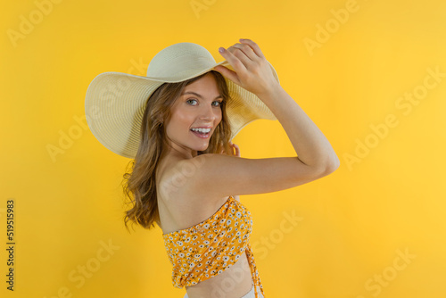 A charming joyful girl is happy at the summer sale in a new sun hats. Concept of summer discounts sale.