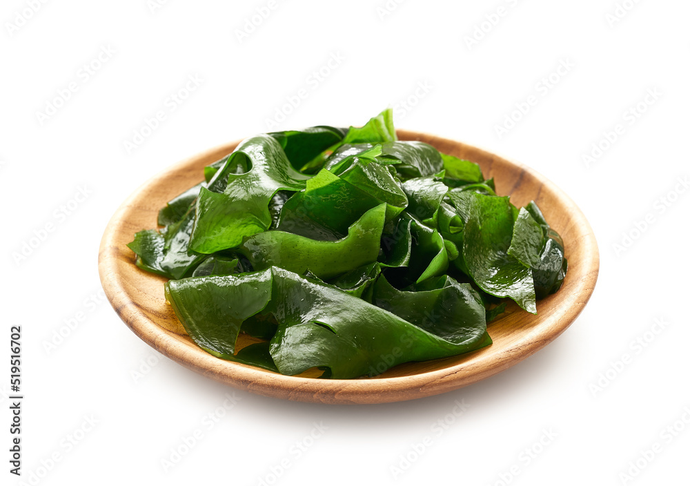 Laminaria (Kelp) Seaweed in wood plate Isolated on White Background. fresh Laminaria or kelp Seaweed in a wooden dish Isolated on White Background. konbu, alga Laminaria (Kelp) Seaweed in wood plate Isolated on White Background. fresh Laminaria or kelp Seaweed in a wooden dish Isolated on White Background. konbu, alga