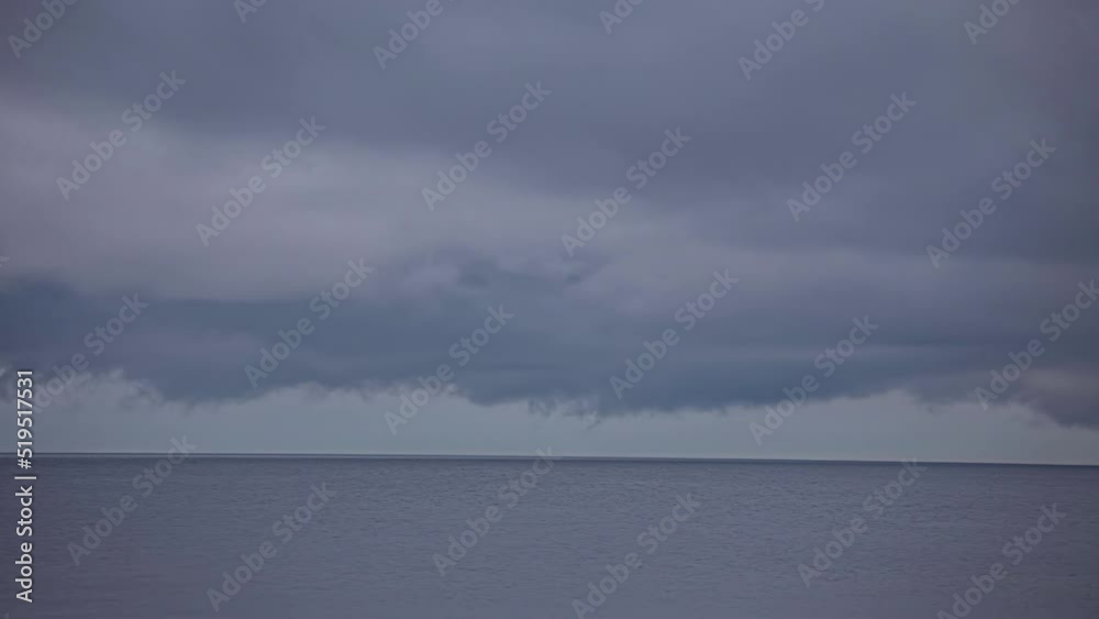 Dark blue fluffy clouds over the sea. Stormy weather timelapse. Dark blue fluffy clouds over the sea. Stormy weather timelapse.