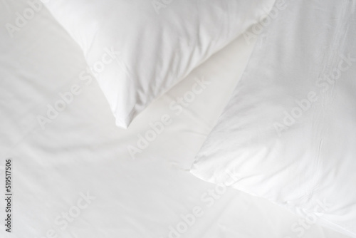 Hypoallergenic pillows with memory foam material on white bedsheet