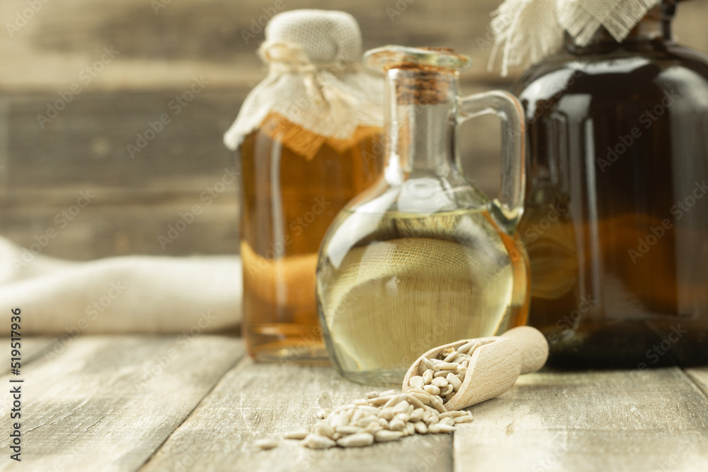 Bottle with fragrant sunflower oil and background with space for text