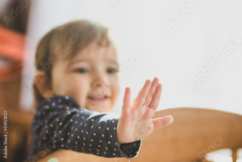 little baby in the bad show hand