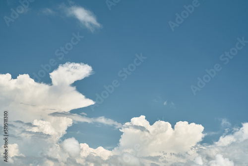 Blue cloudy sky, background for screensaver or wallpaper on the screen or advertising, free space for text.