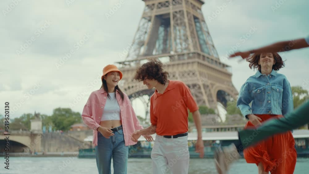 Video of an happy group of millennial teenagers spending time in Paris around the eiffel tower area Video of an happy group of millennial teenagers spending time in Paris around the eiffel tower area