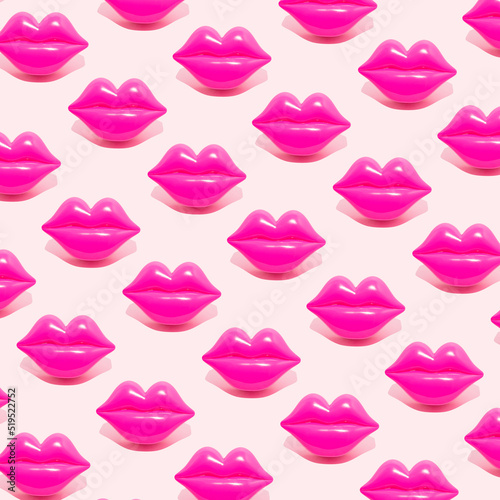 Creative pattern made with magenta lips figurine on pastel pink background. 80s or 90s romantic retro style aesthetic idea. Valentines day concept with kisses.