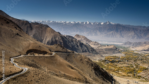 Beautiful view of road to city with mountain and sky background in Leh - Ladakh, northern India.