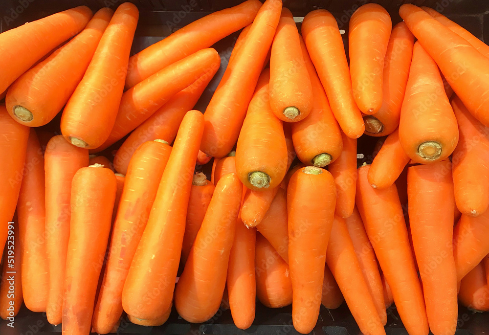 Fresh carrots placed on shelf in the supermarket. Fresh carrots placed on shelf in the supermarket.