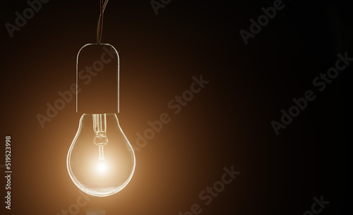 Εκτύπωση καμβά glowing incandescent light bulb on black background