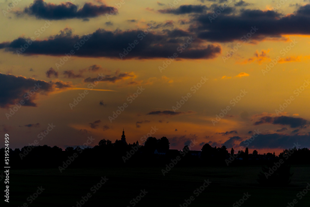 sunset over the village sunset over the village