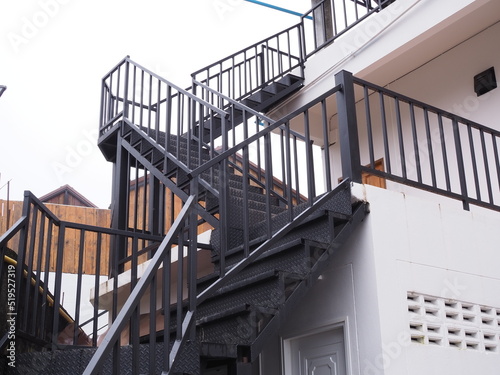 Black steel staircase at the hotel. Dog legged staircase.