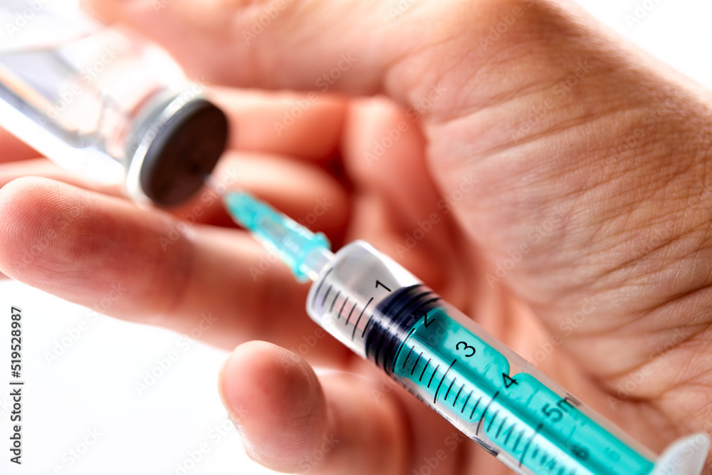 Vaccine in vial with syringe Vaccine in vial with syringe