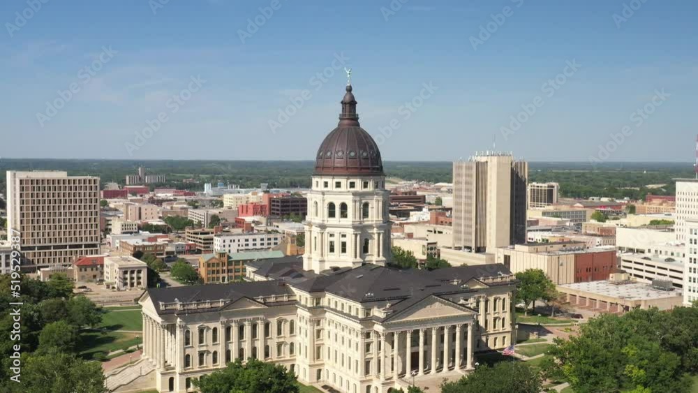 Kansas state capitol building in Topeka, Kansas with close up drone video pulling out at an angle. Kansas state capitol building in Topeka, Kansas with close up drone video pulling out at an angle.