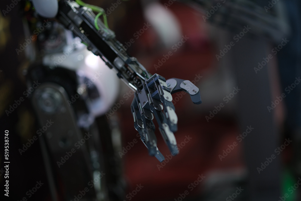 Futuristic black robot arm on black background Futuristic black robot arm on black background