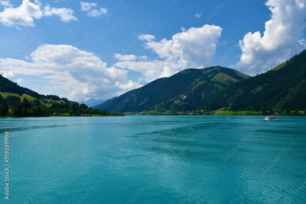 View Weissensee lake and Hochtratten mountain above in Carinthia, Austria