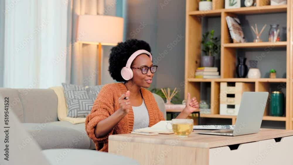 Happy and carefree entrepreneur, freelance or remote worker dancing while listening to music and working on her laptop. One black female freelancer feeling stressless and motivated to succeed Happy and carefree entrepreneur, freelance or remote worker dancing while listening to music and working on her laptop. One black female freelancer feeling stressless and motivated to succeed