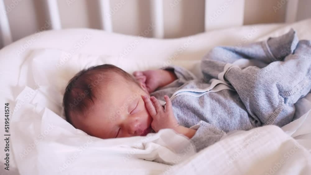 newborn baby sleeping. cute a brunette newborn baby sleeping in bed close up in maternity hospital bedroom. happy family kid dream concept. lifestyle cute newborn baby girl sleeping close up newborn baby sleeping. cute a brunette newborn baby sleeping in bed close up in maternity hospital bedroom. happy family kid dream concept. lifestyle cute newborn baby girl sleeping close up