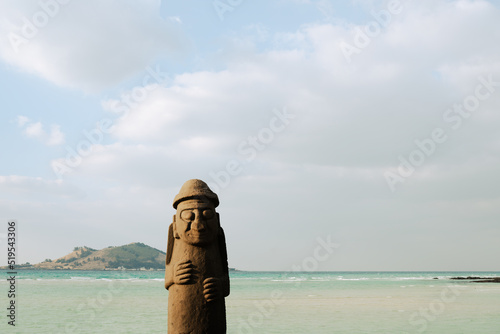 Geumneung Beach and Dolhareubang stone grandpa in Jeju island, Korea photo