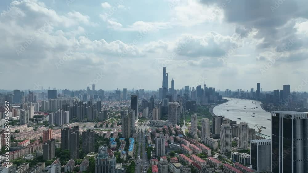Timelapse of Epic Shanghai downtown skyline. Drone aerial view. City landmark buildings, Huangpu river with the cloud moving quickly dramatic mood. Business, economy and travel concept b-roll footage. Timelapse of Epic Shanghai downtown skyline. Drone aerial view. City landmark buildings, Huangpu river with the cloud moving quickly dramatic mood. Business, economy and travel concept b-roll footage.