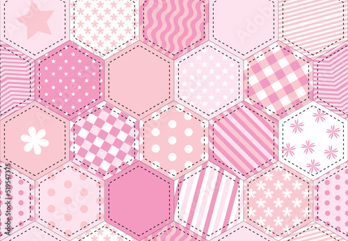 A vector illustration of a patchwork quilt background in shades of pink photo