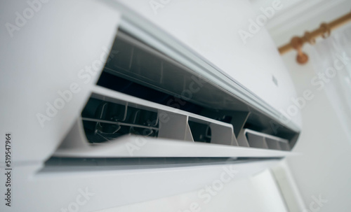 Split air conditioner on a white wall closeup