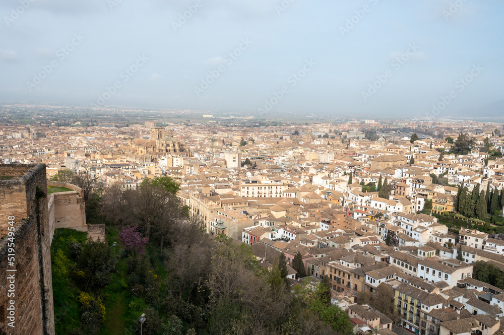 Aerial panoramic view on buildings, old district, mountains and palace, world heritage city Granada, Andalusia, Spain