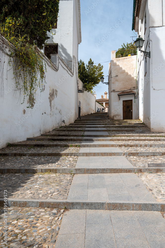 Walking in old central part of world heritage city Granada, Andalusia, Spain