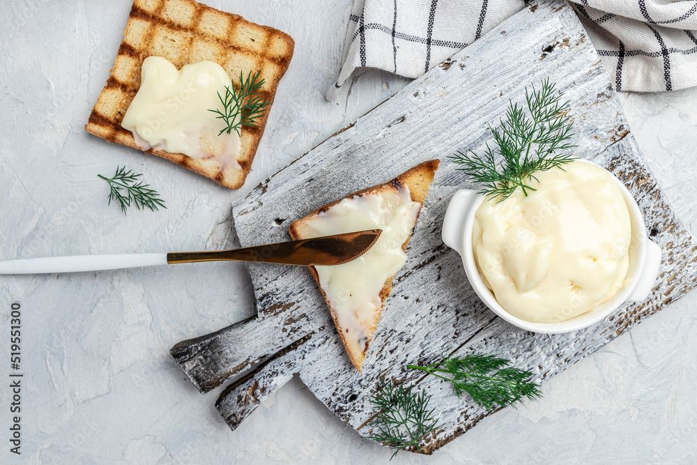 Fresh sandwich with cream cheese and butter for breakfast. melted cheese sandwich on light background. Food recipe background. Close up Fresh sandwich with cream cheese and butter for breakfast. melted cheese sandwich on light background. Food recipe background. Close up