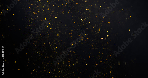 Gold glitter shimmer dust shiny lights particles dark abstract background