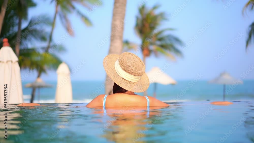 Back View of Unrecognizable Woman With Floppy Hat and Bikini Standing ...